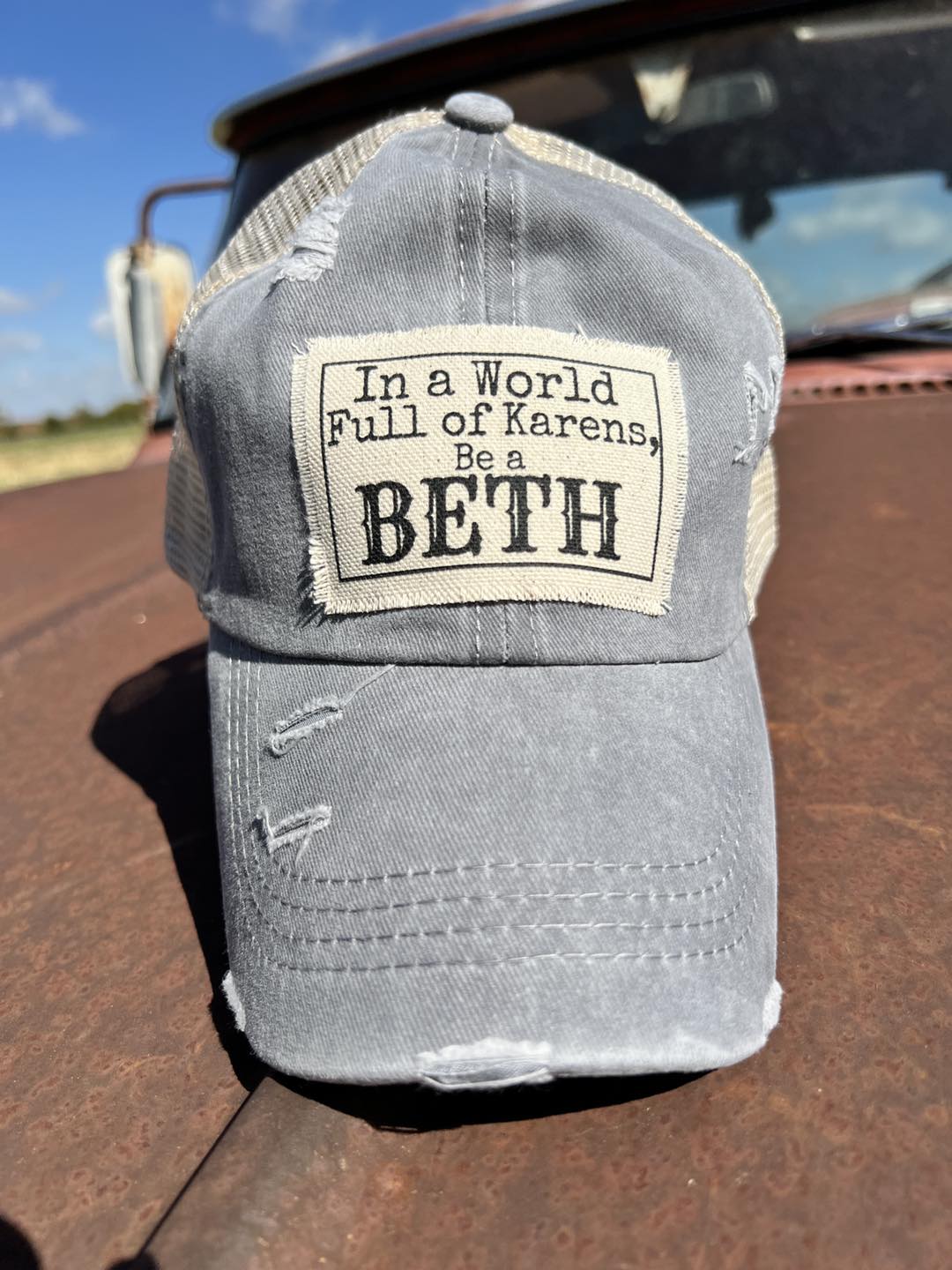 In a World Full of Karen's Be a Beth High Back Pony Hat